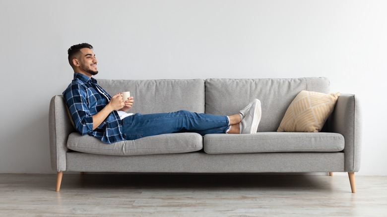 man resting on sofa