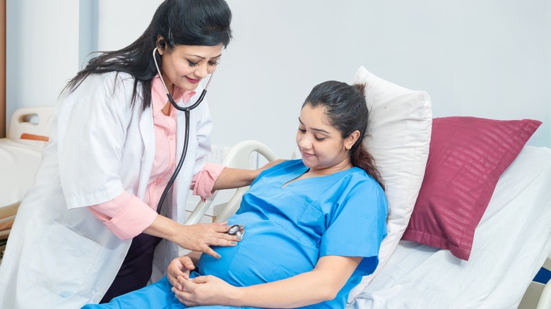 pregnant woman in hospital bed