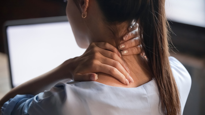 woman with neck and back pain