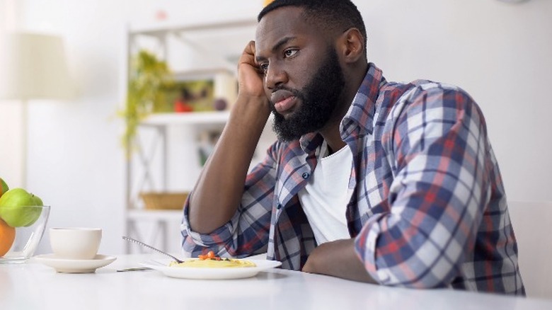 Black man having little appetite