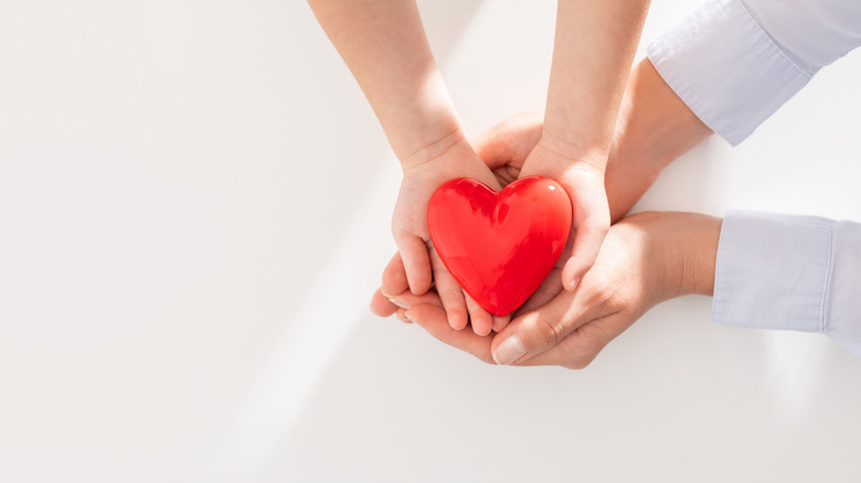 Hands holding a heart