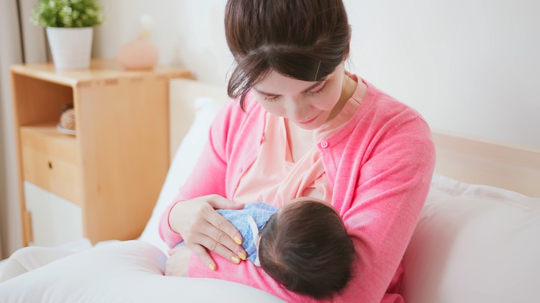 Woman breastfeeding baby