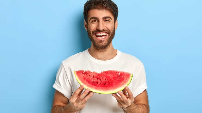 Man holding watermelon