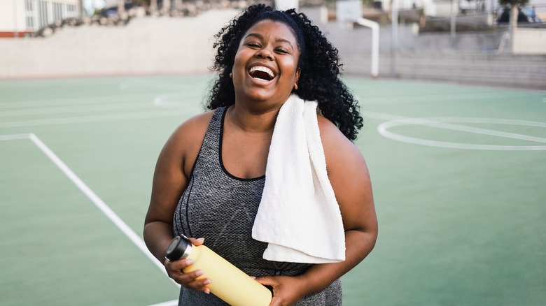 laughing woman in workout gear