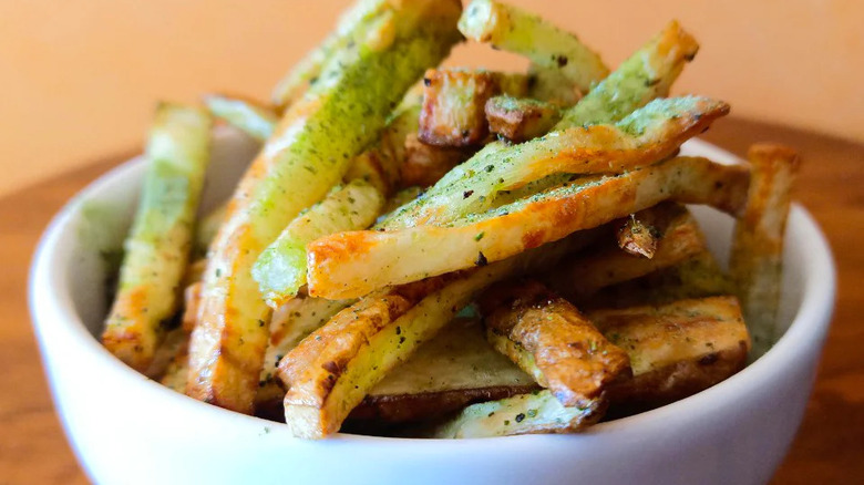 fries with green salt sprinkled on top