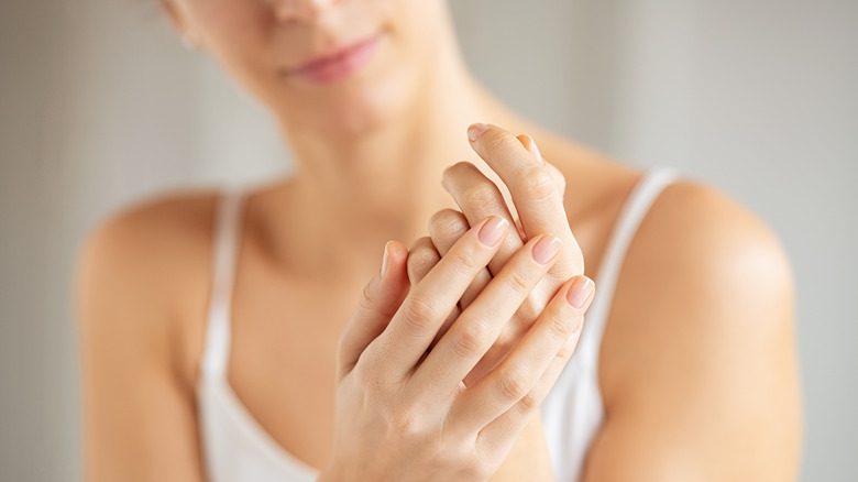 Woman rubbing hands together