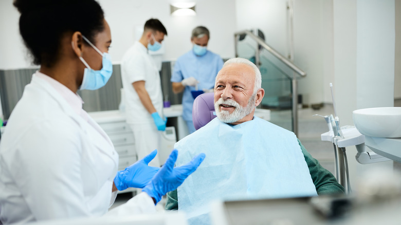 man and dentist talking