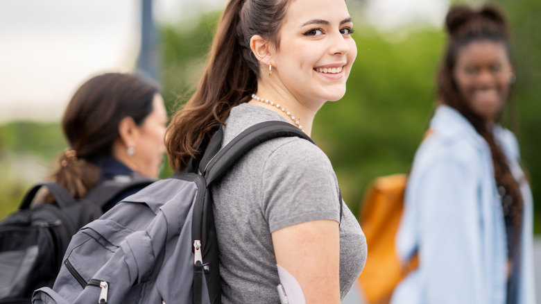 Girl with blood glucose monitor