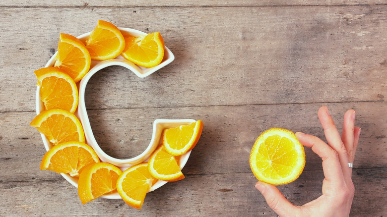 plate in shape pf letter C with orange slices; concept of vitamin C