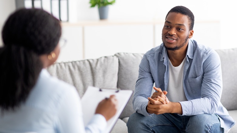 man talking to therapist