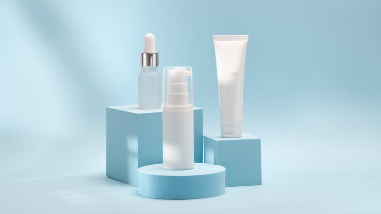 three skincare products on pedestals 
