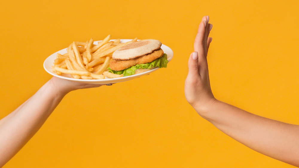 Hand turning down a meal