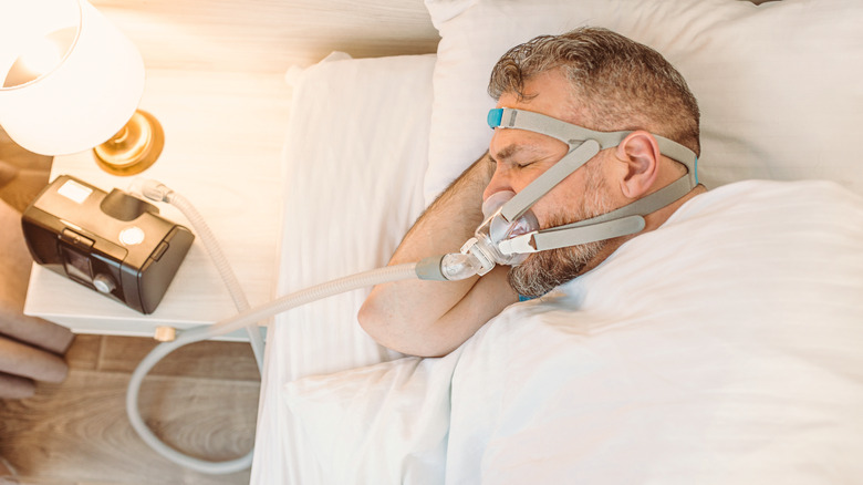 Man with CPAP machine