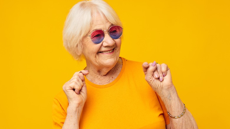 happy older woman with funky glasses