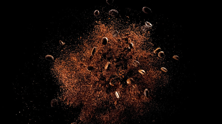 Smashed coffee beans on a black background