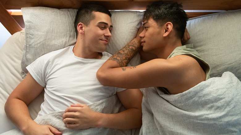 two men in bed