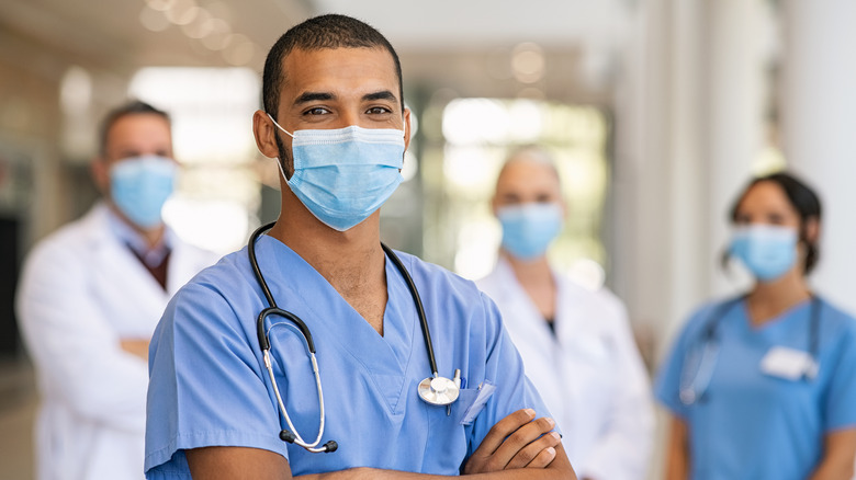 A nurse wearing a mask