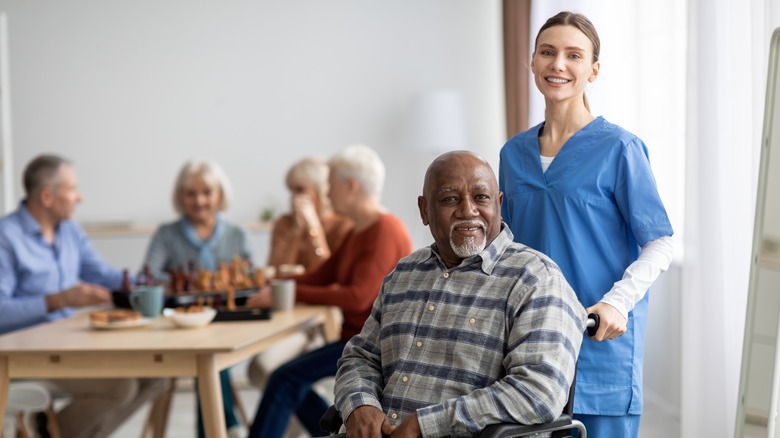 Man in a nursing home with healthcare worker