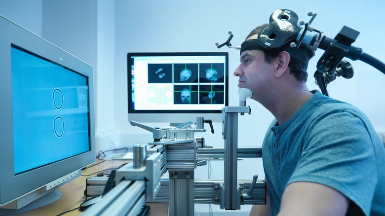 man having transcranial magnetic stimulation treatment