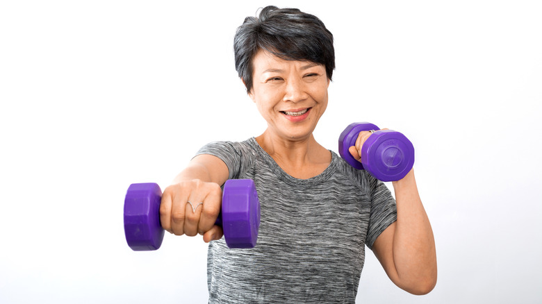 Older woman lifting weights