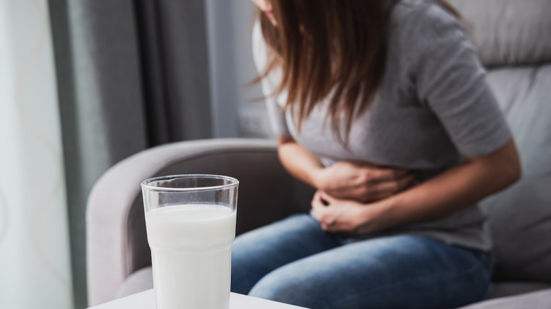 Woman clutching stomach