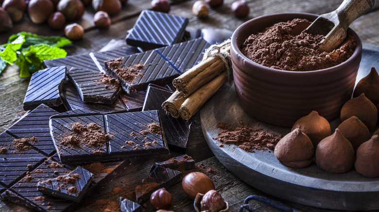 dark chocolate, cocoa, and cocoa beans on a table