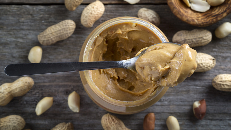 Spoonful of peanut butter out of jar