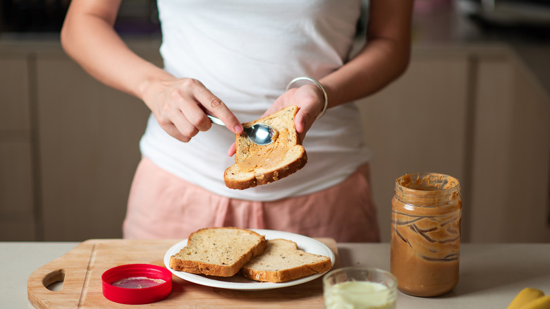 Woman spreading peanut butter