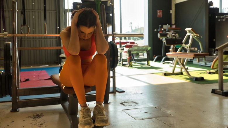 Anxious woman at gym