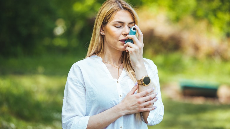 Individual using an inhaler