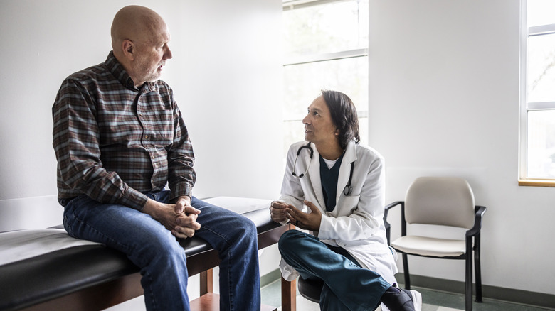 Doctor speaking to patient 