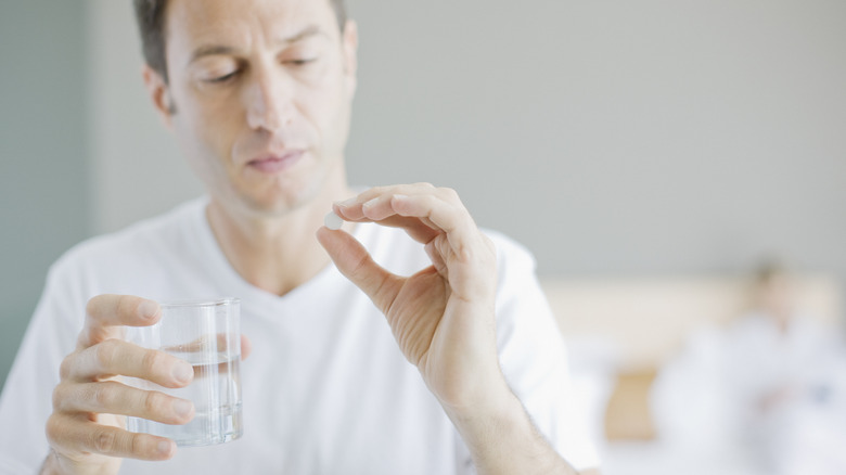 Man taking medication