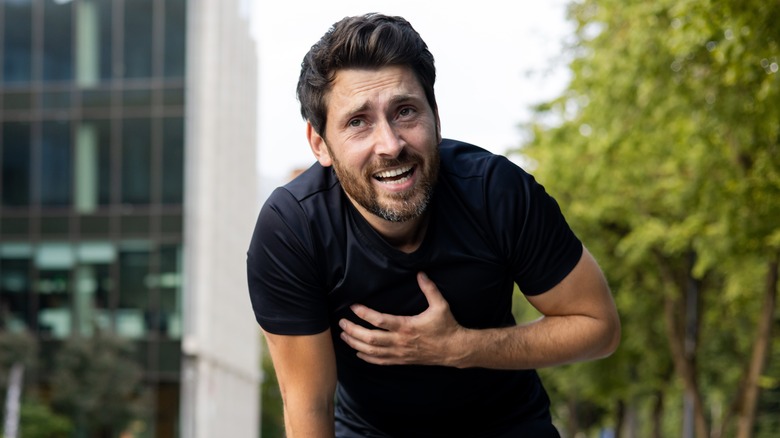 A man experiencing chest pains during exercise