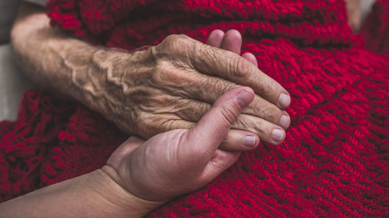 woman comforting her dying grandmother