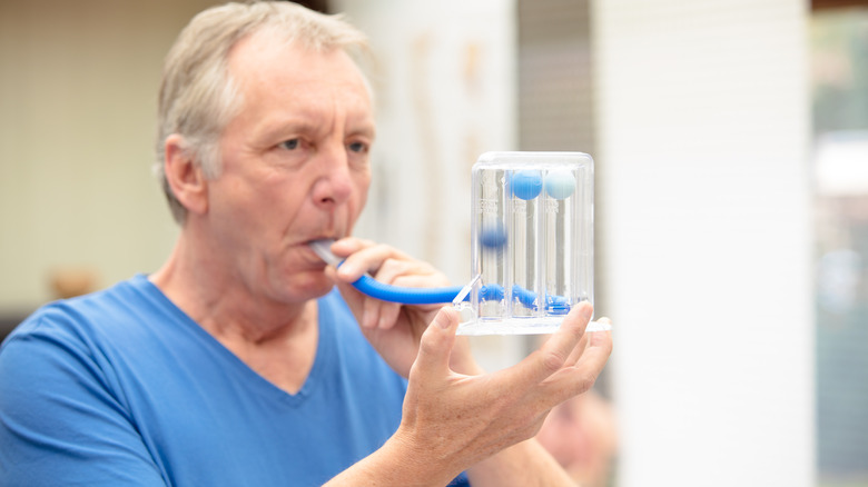 Individual using a breathing machine