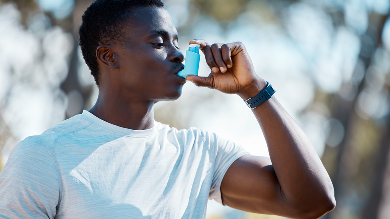 Person using an inhaler