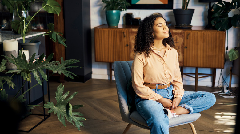 Woman meditating in chair