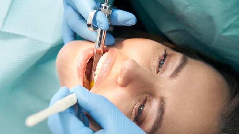 Dentist looking in mouth