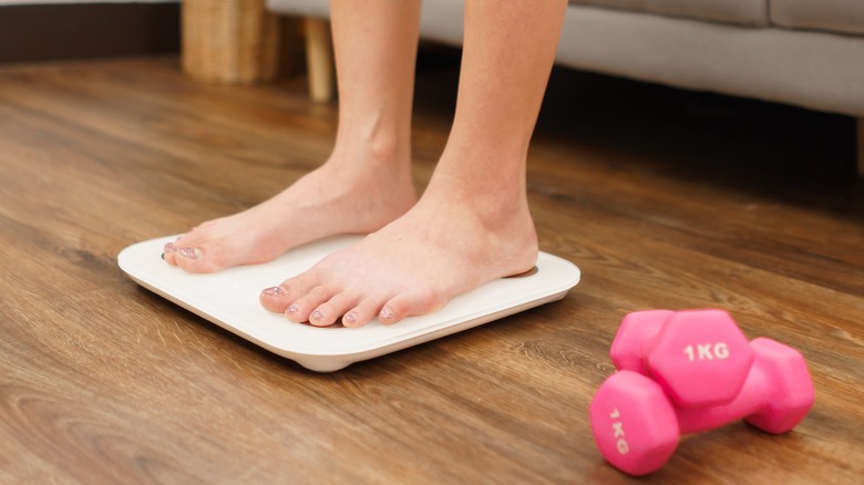 Weighing scale and dumbbells