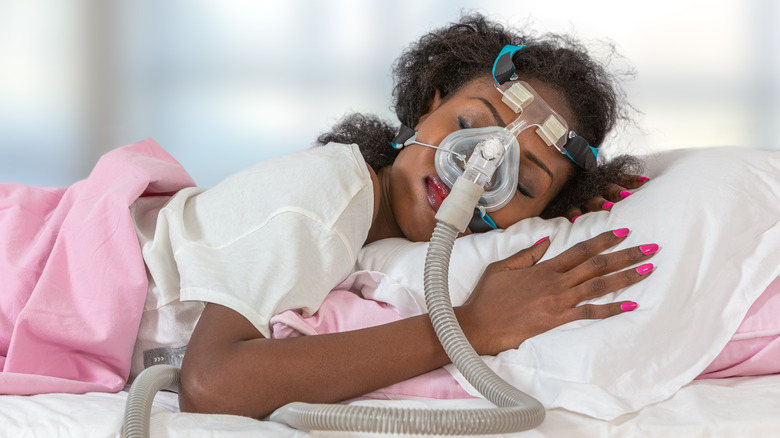 Woman wearing CPAP machine