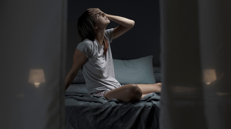 Frustrated woman awake at night