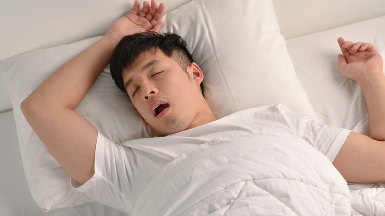 man sleeping with his mouth open