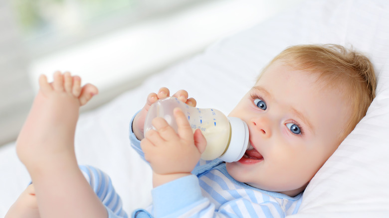 baby drinking milk from bottle