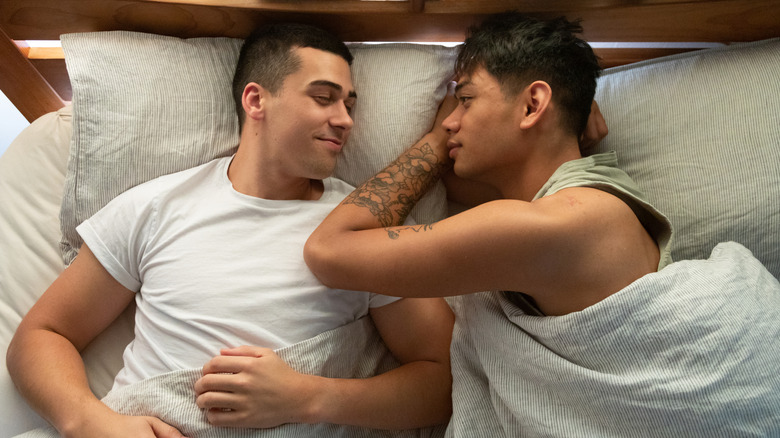 two men in bed