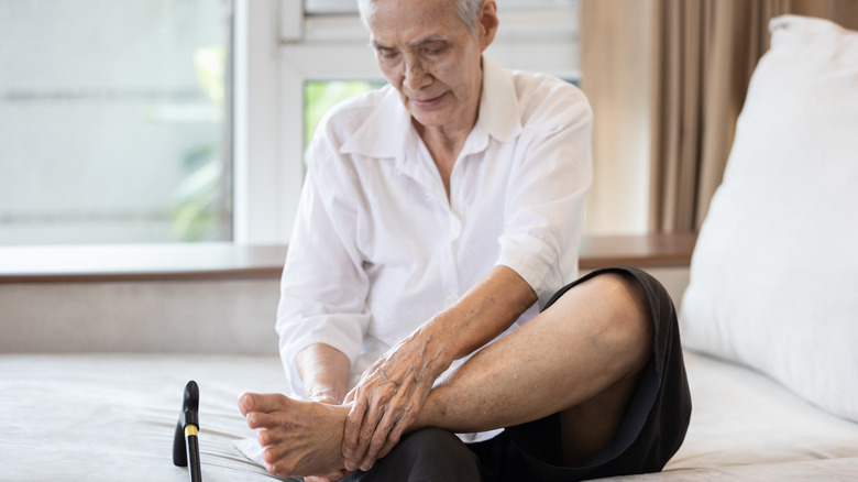 older woman experiencing foot pain