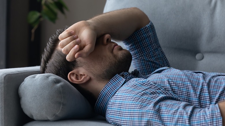 Man laying on couch