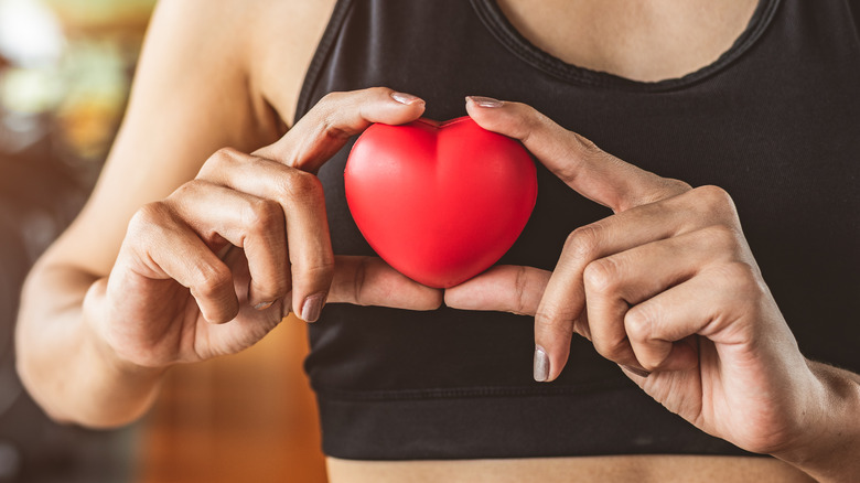woman at the gym with a heart