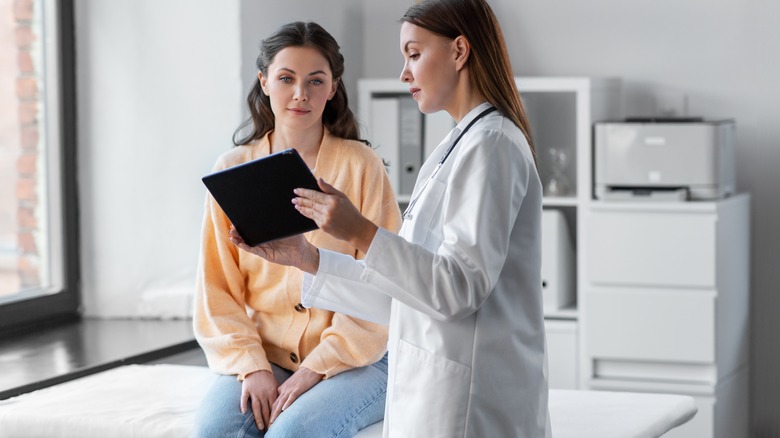 doctor showing patient lab results