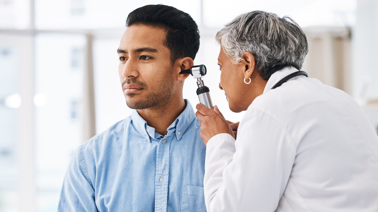 man at ear doctor