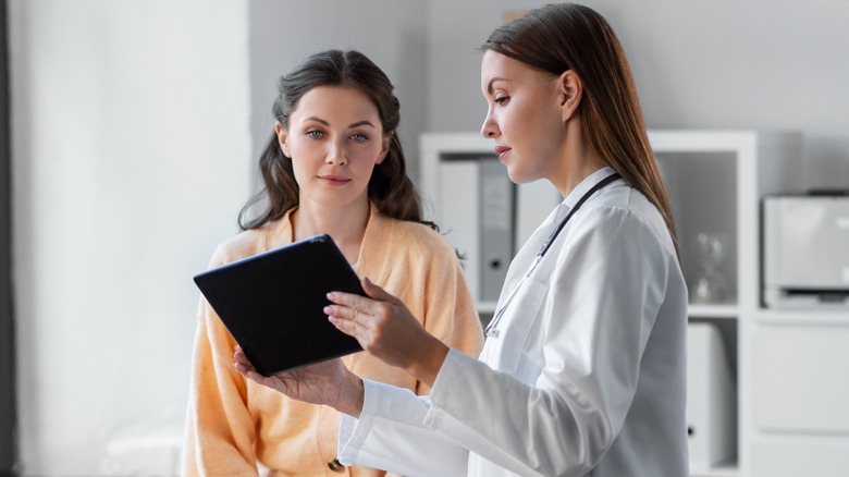 doctor checking patient 